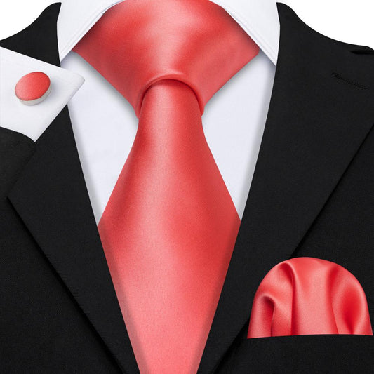 black suit orange tie