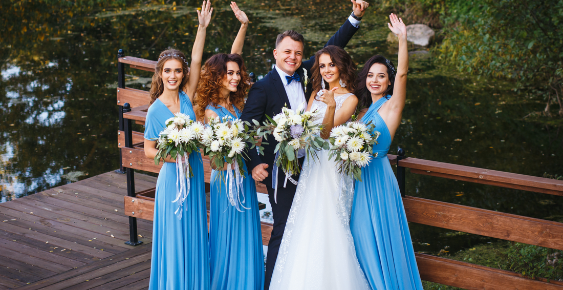 Photo of newlyweds and bridesmaids