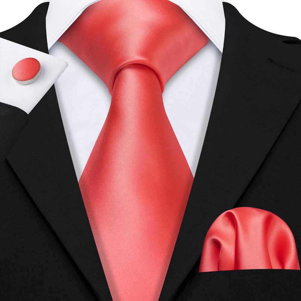 black suit orange tie